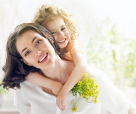 The girl carrying the little girl Stock Photo