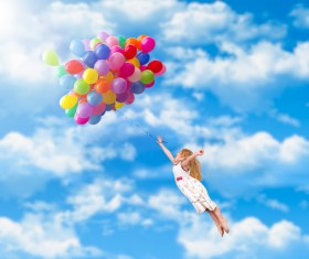 The little girl holding balloons fly HD picture