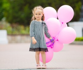 The little girl holding the balloon HD picture