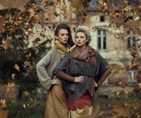 The two beautiful women in the leaves Stock Photo