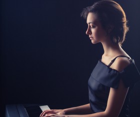 The woman playing the piano Stock Photo