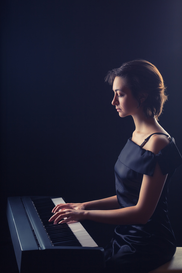 The woman playing the piano Stock Photo