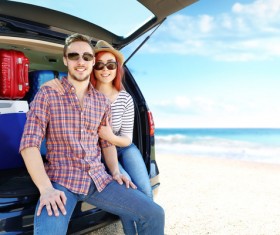 Travel couples at the seaside Stock Photo