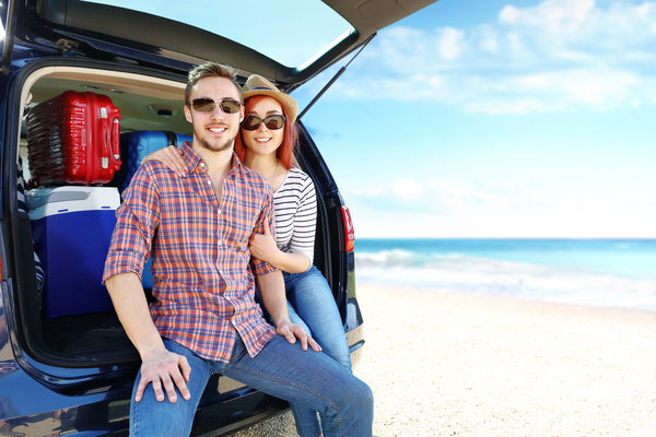 Travel couples at the seaside Stock Photo
