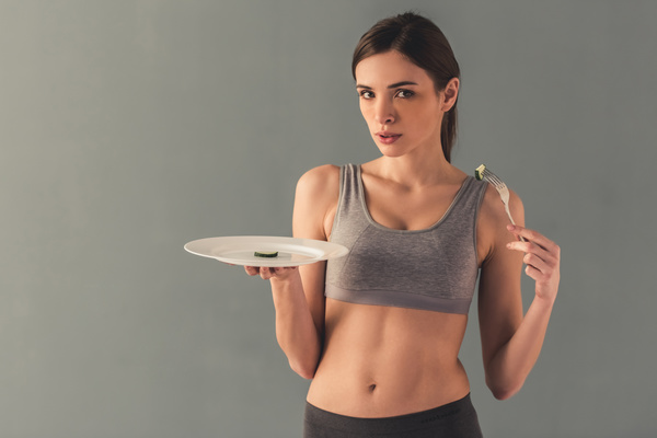 Weight loss of women with food Stock Photo