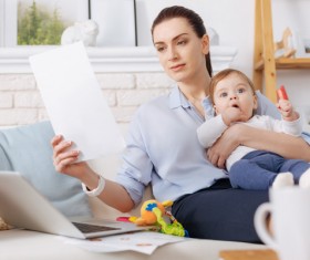 While working while taking care of the childs mother Stock Photo 01