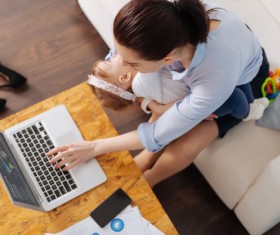 While working while taking care of the childs mother Stock Photo 03