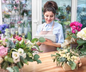 Woman working in florist Stock Photo 01