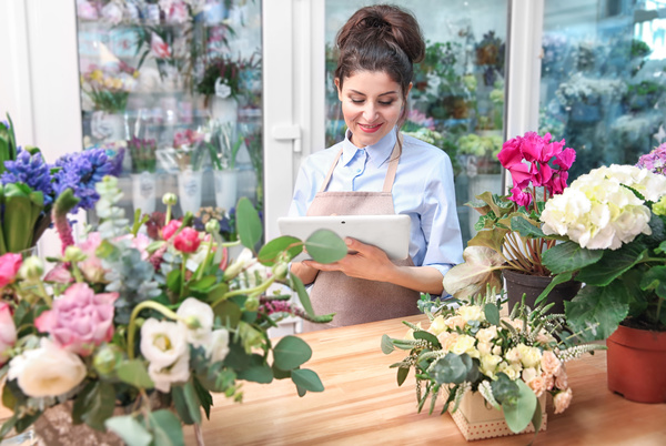 Woman working in florist Stock Photo 01