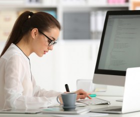 Working in the office beautiful female programmer Stock Photo 02