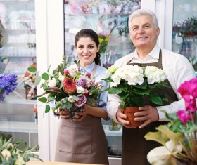 Working women and men in the flower shop Stock Photo 02
