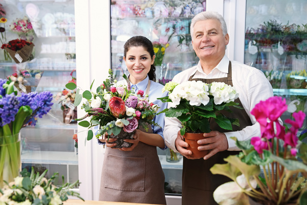 Working women and men in the flower shop Stock Photo 02