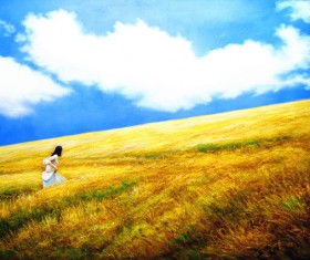Yellow girl in the wheat field Stock Photo