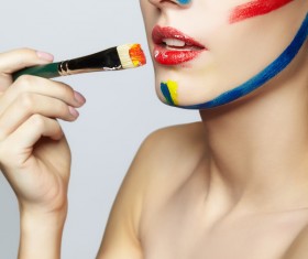 woman with a paint on her face and a brush HD picture 04