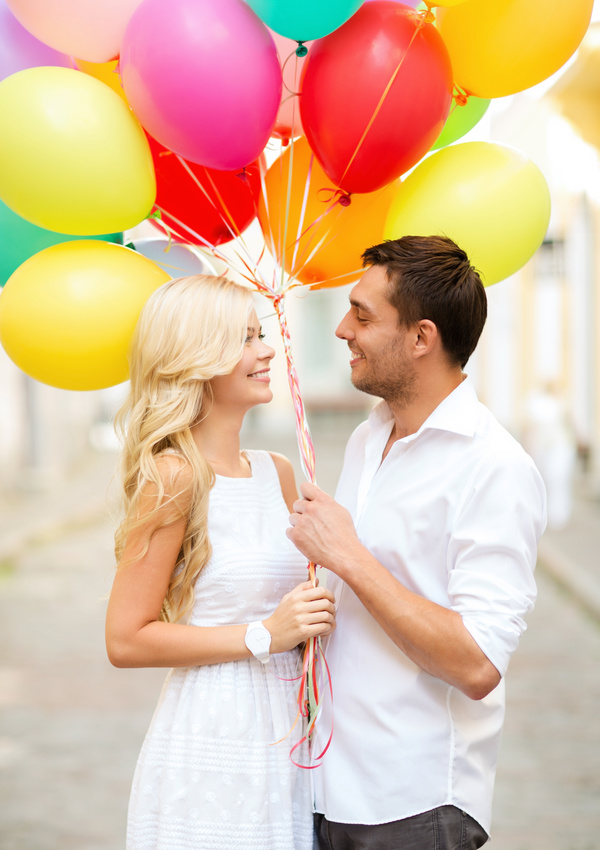 A couple holding a balloon Stock Photo