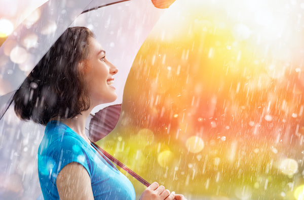 Beautiful woman in the rain Stock Photo