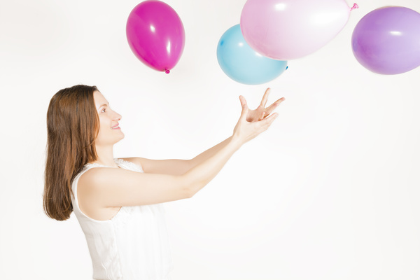 Catch a balloon woman Stock Photo