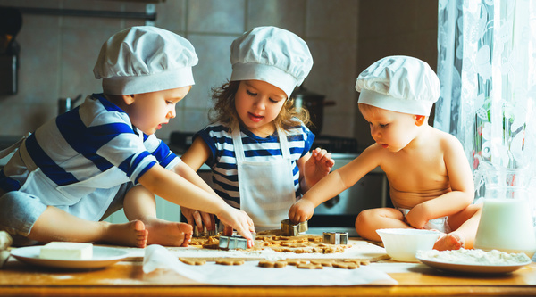 Children making cookies in the kitchen Stock Photo