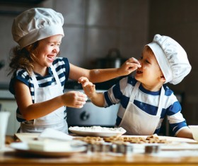 Children playing in the kitchen Stock Photo
