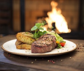 Delicious steak with potato vegetables Stock Photo