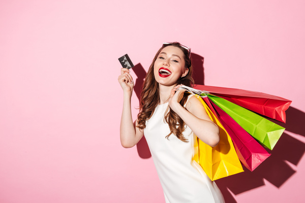 Expression cheerful shopping woman Stock Photo