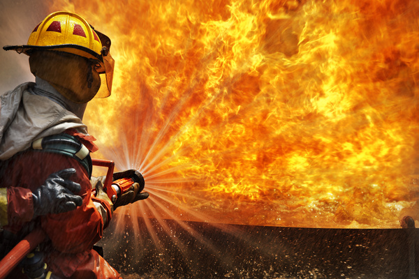 Firefighters extinguishing Stock Photo