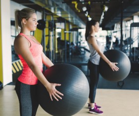 Girl holding a fitness ball Stock Photo