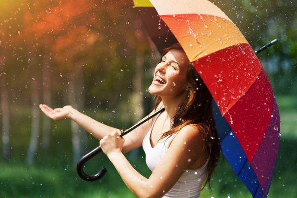 Happy woman in the rain Stock Photo