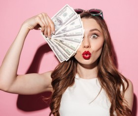 Holding a dollar woman Stock Photo