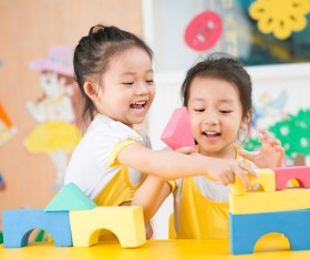 Kindergarten children building blocks Stock Photo
