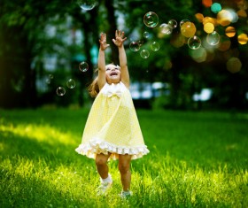 Little girl chasing bubbles HD picture
