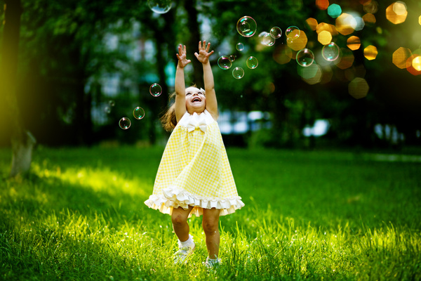 Little girl chasing bubbles HD picture