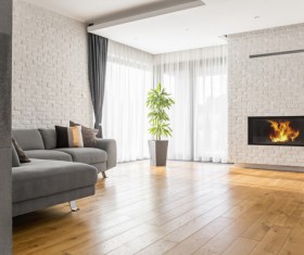 Living room with fireplace and corner sofa Stock Photo
