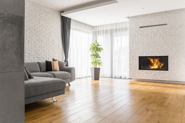 Living room with fireplace and corner sofa Stock Photo