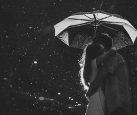 Night rain hug couple Stock Photo