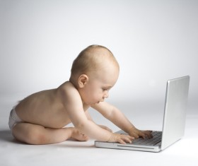 Playing computer baby Stock Photo