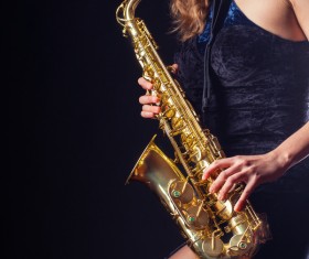 Saxophone playing woman Stock Photo