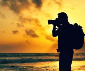 Shooting sunset photographer Stock Photo