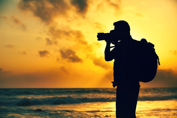 Shooting sunset photographer Stock Photo