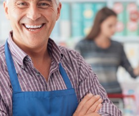 Smiling supermarket staff Stock Photo