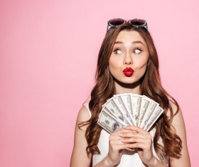 Strabismus woman holding dollars Stock Photo