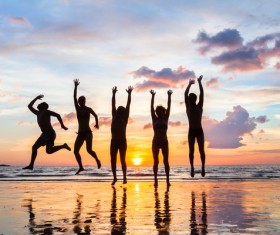 Sunset seaside happy people jumping HD picture