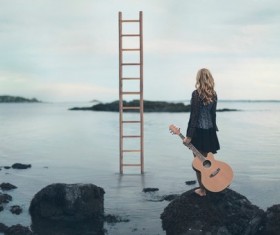Take the guitar girl Stock Photo