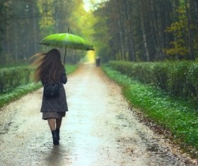 The girl walking in the forest path Stock Photo