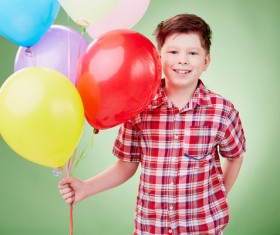 The little boy took the balloon Stock Photo
