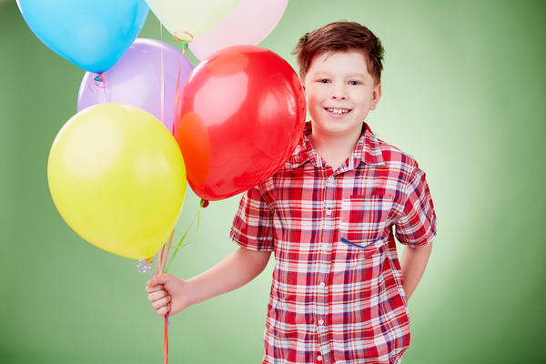 The little boy took the balloon Stock Photo