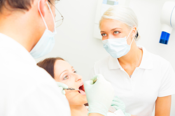 The nurse dentist treated patients Stock Photo