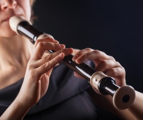 The woman who blows the flute Stock Photo