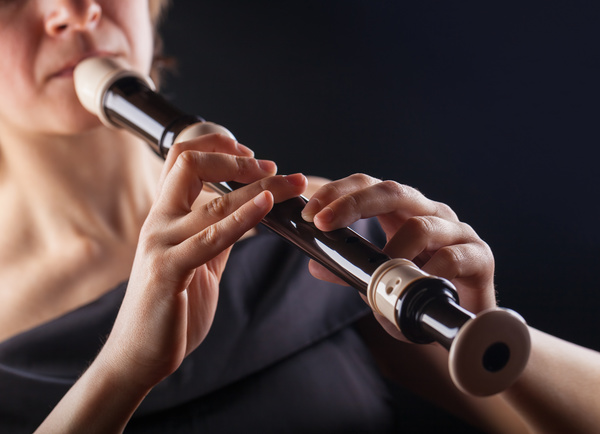 The woman who blows the flute Stock Photo