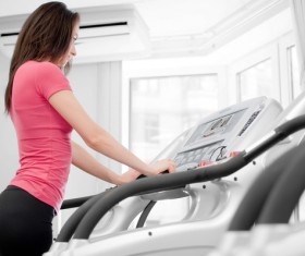 Treadmill on the girl Stock Photo